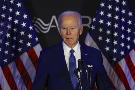 President Biden speaking at a podium.
