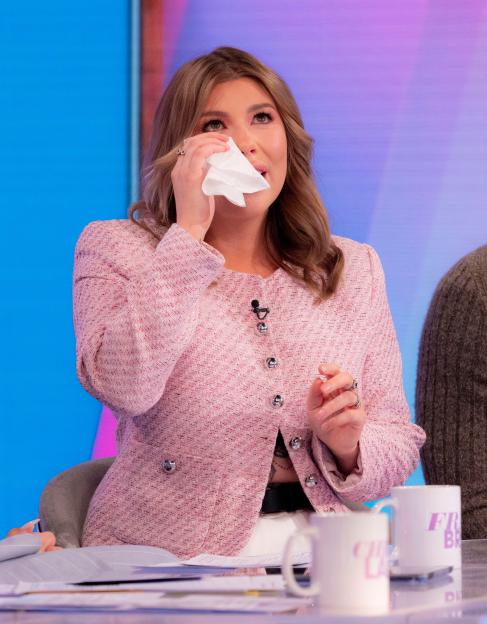 Woman wiping away tears.