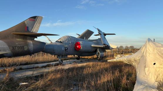 Rotting Hawker Hunter jet in a UK ex-military plane graveyard.