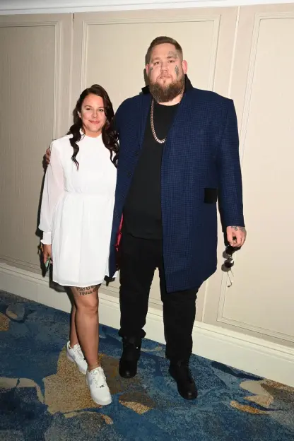 Photo of a man and a woman posing together.