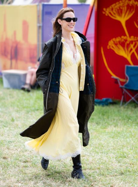 Alexa Chung smiling during day three of Glastonbury Festival 2024.