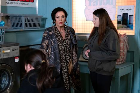 Scene from EastEnders showing Kat Slater and Lily Slater in a laundromat.