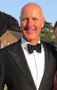 Portrait of Graham King, 56, in a tuxedo.
