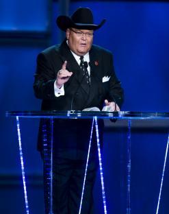 Jim Ross speaking at a podium.