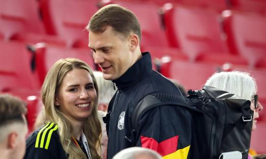 Manuel Neuer and his wife Anika Bissel at a soccer match.