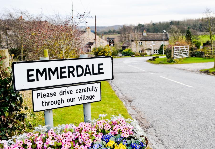Emmerdale village sign and road.