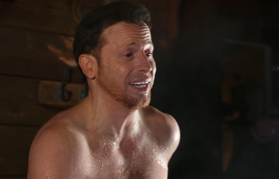 Joe Swash, shirtless and sweating, in a hot tub.