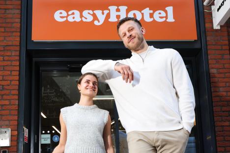 One of Britain’s tallest men puts height to the test by spending night in UK’s smallest hotel room