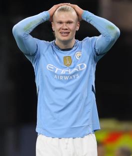 Erling Haaland of Manchester City looking dejected during a soccer match.