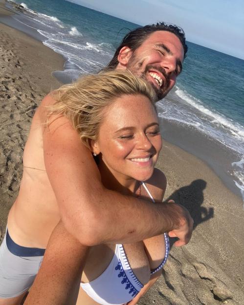 Couple embracing on a beach.