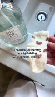 A stained sock being treated with M&S fabric stain remover.