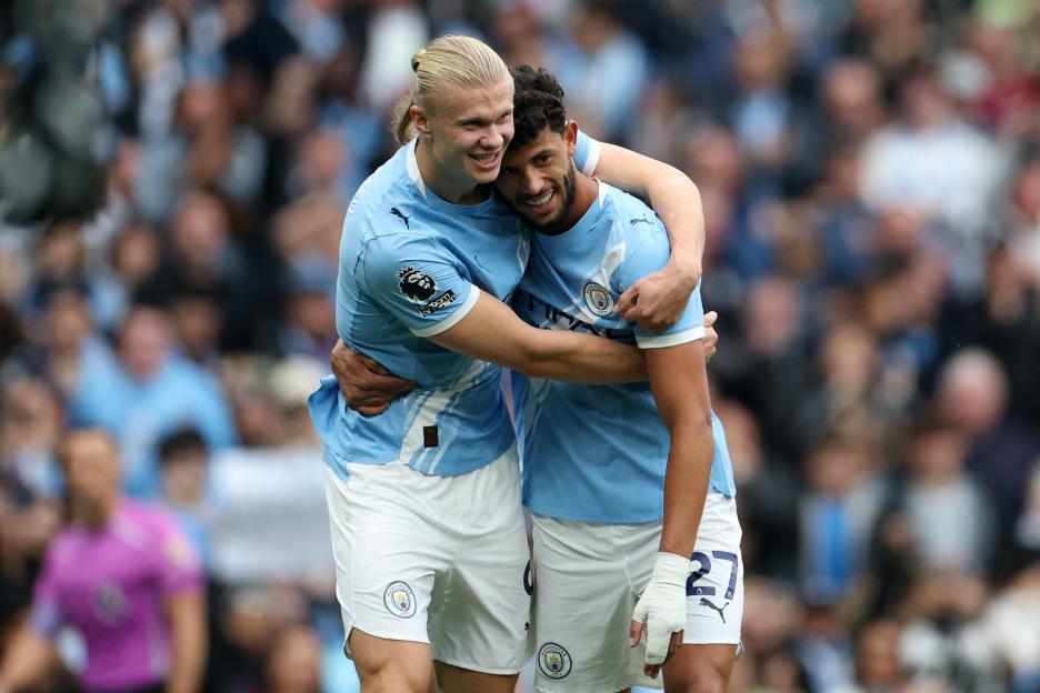 Erling Haaland celebrating with Matheus Nunes.