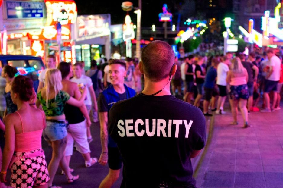 Security guard at a night market.