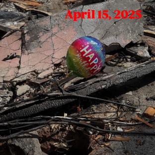 Birthday balloon in rubble.