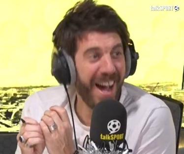 Andy Goldstein laughing while on a talkSPORT radio show.