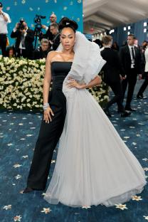 Emma Chamberlain at the Met Gala in a backless pinstripe suit.