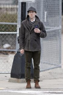 Erik Per Sullivan holding a coffee cup.