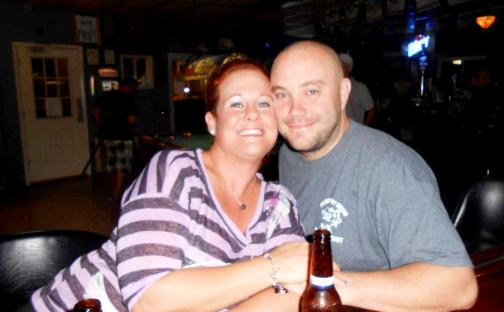 Photo of a couple at a bar.