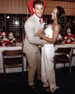 A happy couple embracing on their wedding day.
