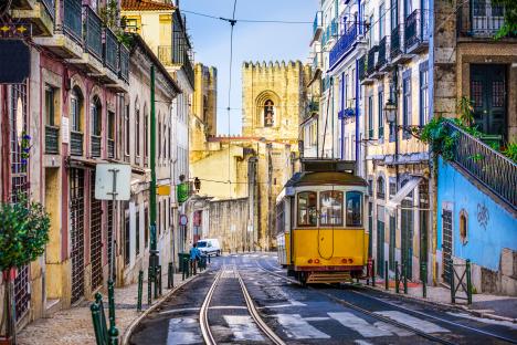 Lisbon tram on a narrow street.
