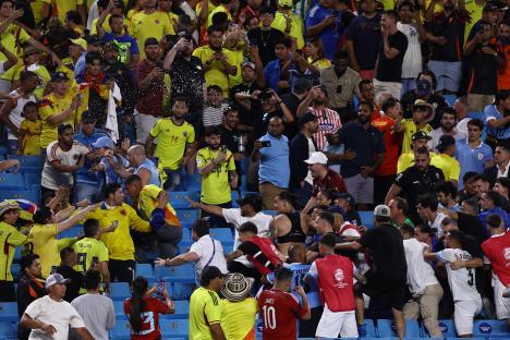 A brawl between Uruguay and Colombia fans at a soccer match.