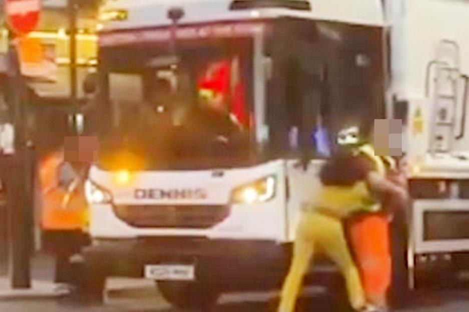Moment woman breaks into bin lorry after being slapped by fuming workmen in ‘road rage’ row