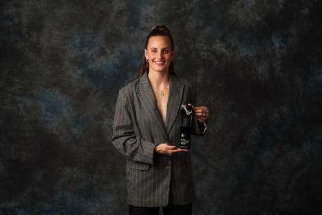 Nathalie Bjorn holding her Chelsea Women's Player of the Season award.