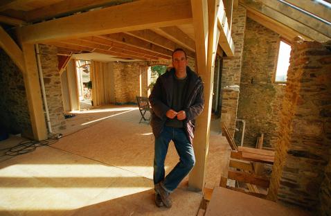 Presenter Kevin McCloud at Lower Hutcherleigh Barns during renovations.