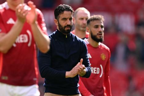 Manchester United's Portuguese head coach Ruben Amorim and players applaud fans after the English Premier League football match between Manchester United and West Ham United at Old Trafford in Manchester, north west England, on May 11, 2025. West Ham won the game 2-0. (Photo by Oli SCARFF / AFP) / RESTRICTED TO EDITORIAL USE. No use with unauthorized audio, video, data, fixture lists, club/league logos or 'live' services. Online in-match use limited to 120 images. An additional 40 images may be used in extra time. No video emulation. Social media in-match use limited to 120 images. An additional 40 images may be used in extra time. No use in betting publications, games or single club/league/player publications. / (Photo by OLI SCARFF/AFP via Getty Images)