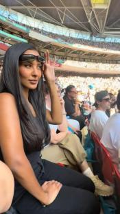 Maya Jama at a football match.