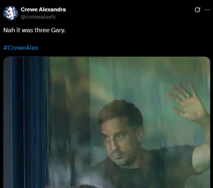 Screenshot of a man seen through a blurry window.