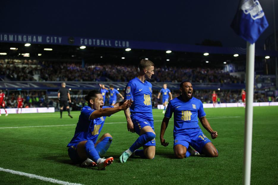 Birmingham City players celebrating a goal.