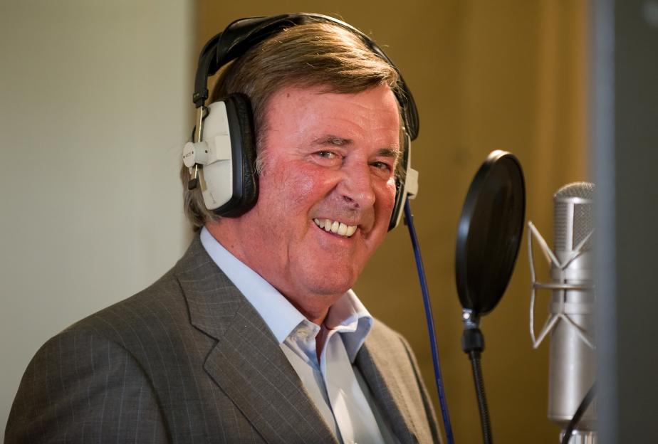 Terry Wogan recording in a studio.