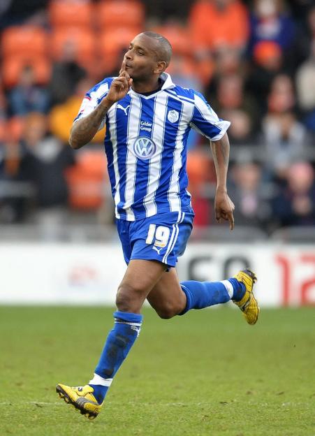 Soccer player celebrating a goal.