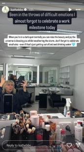 Woman celebrating a work milestone in a makeup room.