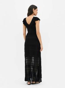Model wearing a black maxi dress with ruffle detailing.