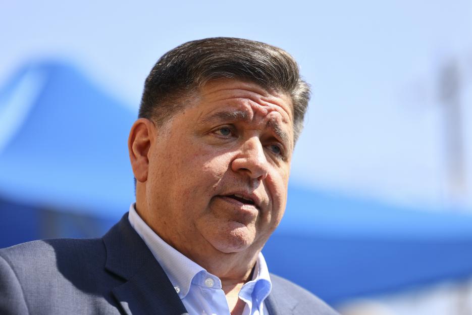 Gov. JB Pritzker speaking with reporters.