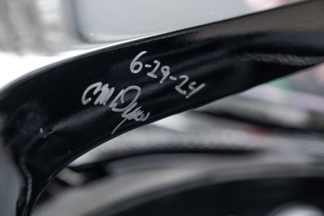 Close-up of a signature on the Batmobile.
