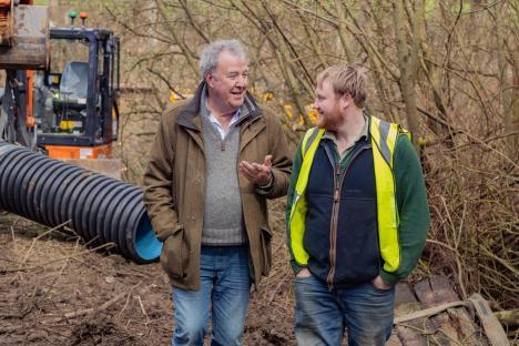 Jeremy Clarkson and Kaleb Cooper talking on a farm.