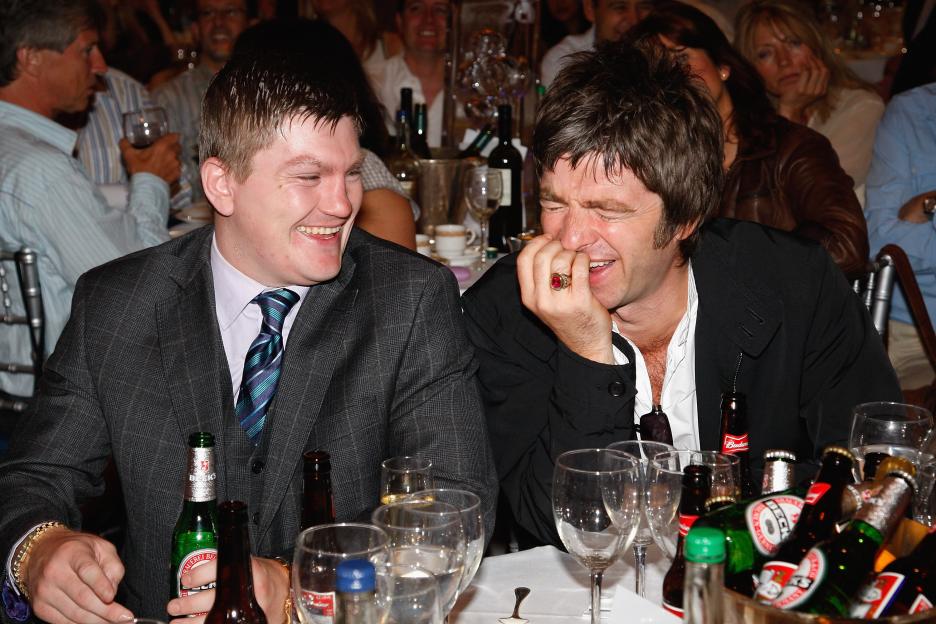 Boxer Ricky Hatton and musician Noel Gallagher laughing at the O2 Silver Clef Awards.