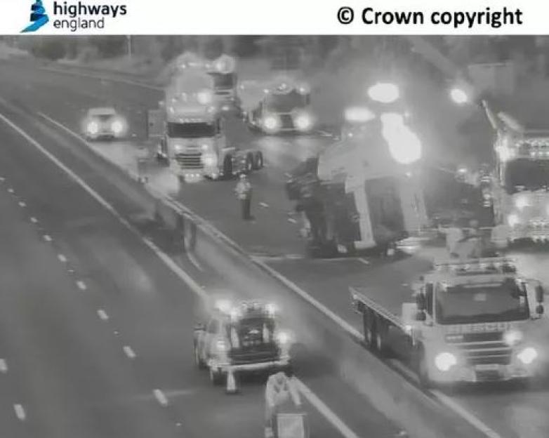 Major motorway closed after lorry hits barriers and overturns spilling diesel all over carriageway