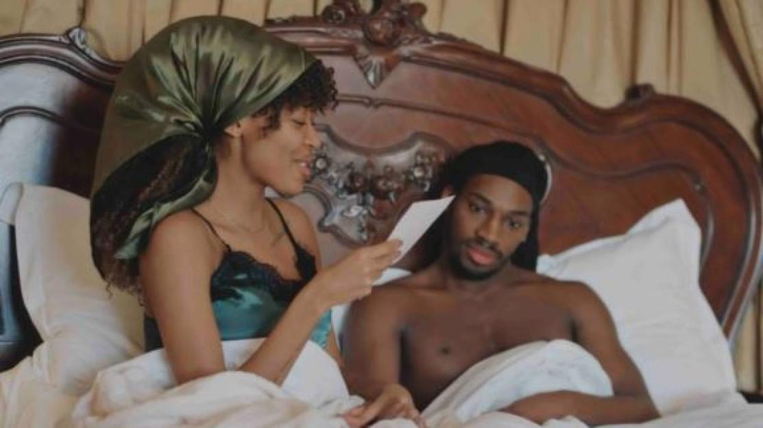 Divarni and Julie-Ruth from Married at First Sight lying in bed.