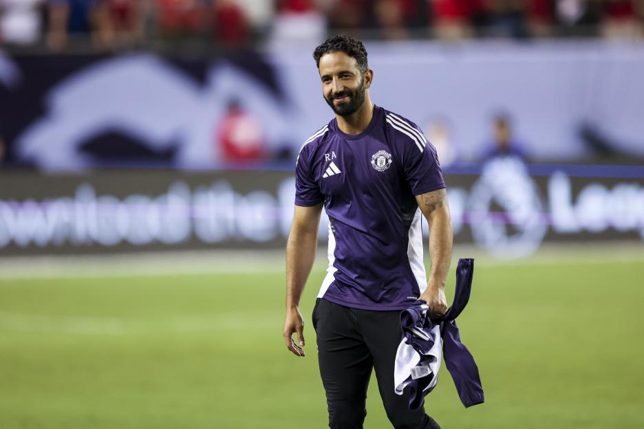 Ruben Amorim, Manchester United head coach, on a soccer field.
