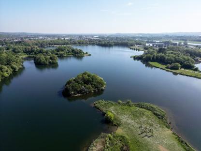 Aerial view of Colwick Country Park lake.