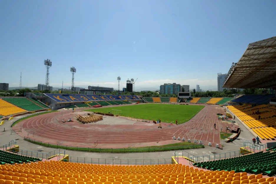 Wide view of an empty stadium with a running track.