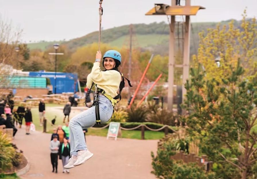 Woman ziplining at Craig Tara holiday park.