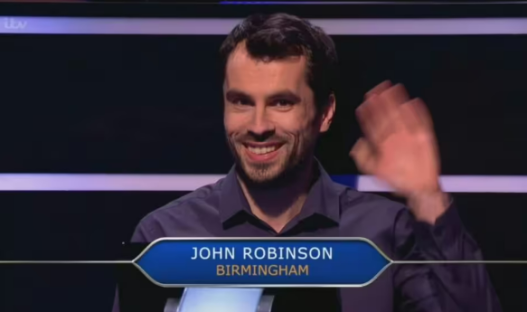 John Robinson, contestant on Who Wants To Be A Millionaire, waving.