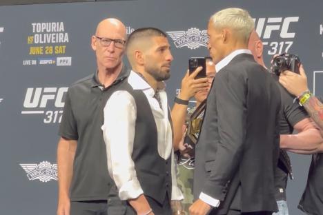 Watch Ilia Topuria and Charles Oliveira have heated conversation during UFC 317 face off as Dana White watches on