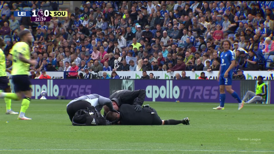 Soccer player receiving medical attention on the field.