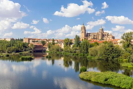 The New Cathedral of Salamanca reflected in the Tormes River.